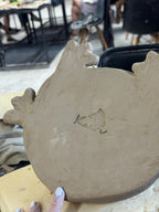 Bottom of the frog sculpture showing handmade Kaeru logo