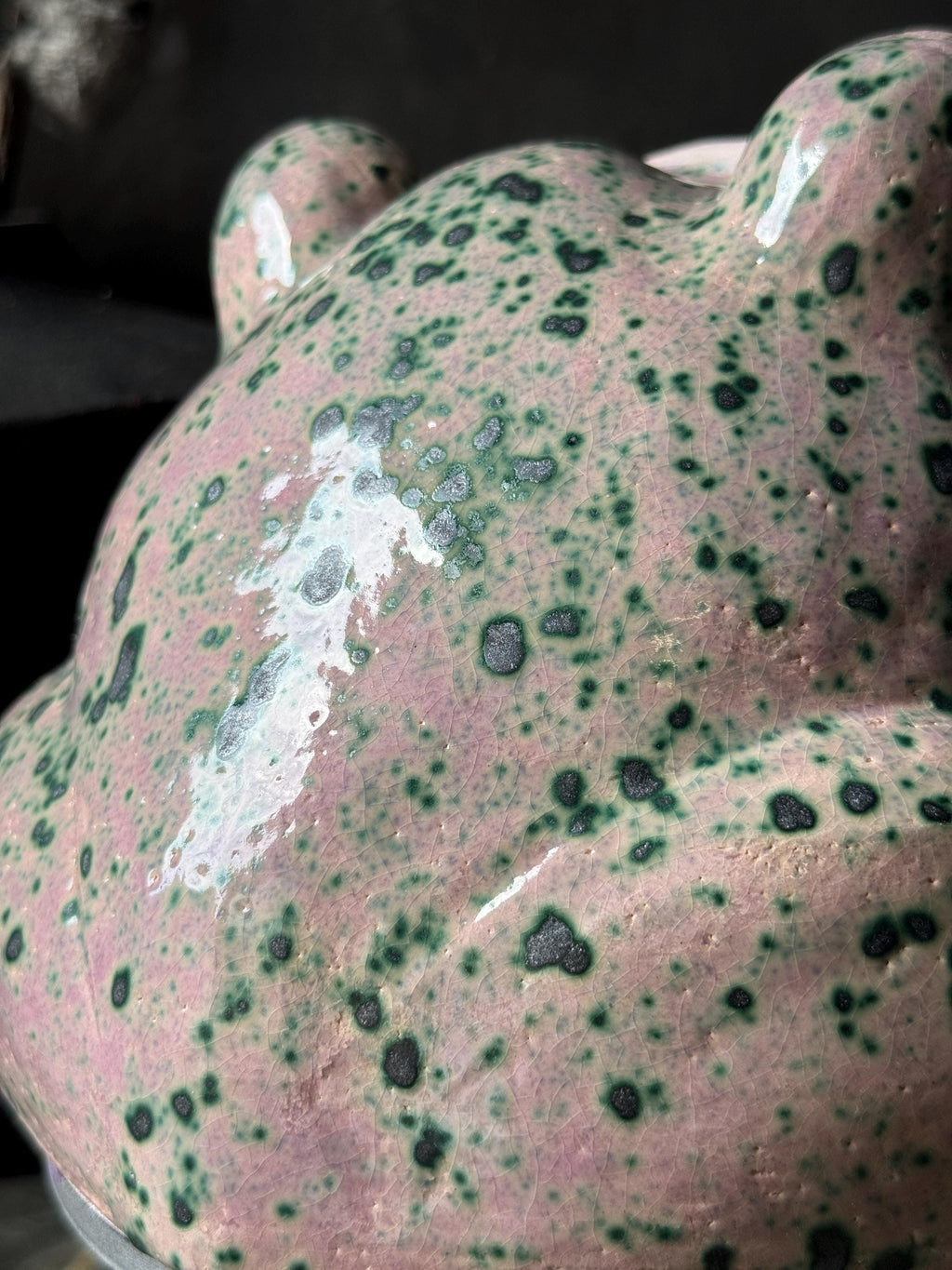 Detailed close-up of ceramic surface with green Botz glaze