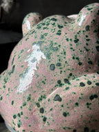 Detailed close-up of ceramic surface with green Botz glaze